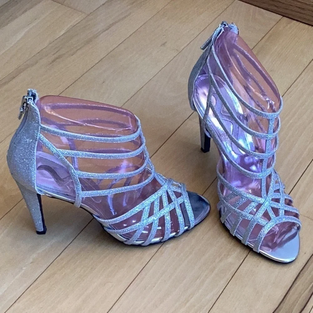 Nina silver glittery, strappy high heels, zipper to back. Women’s size 7